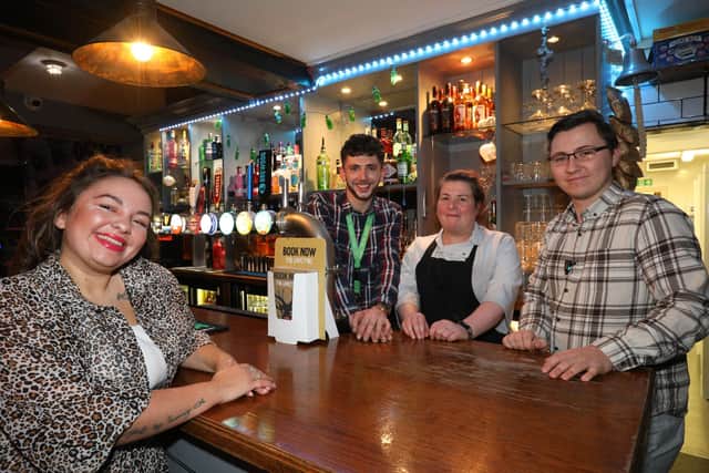 Manageress Jordan Probert, left, and her staff at The Lord John Russell. Going out in Albert Road, Southsea, on the last weekend before Christmas
Picture: Chris Moorhouse (jpns 171221-40)