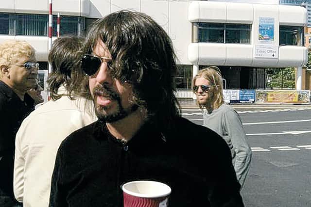 Foo Fighters on the Wightlink ferry in 2011, with Taylor Hawkins on the right
