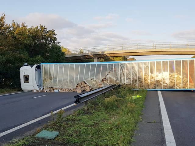 Officers received report of a lorry overturning and a car colliding with the lorry. Picture: Sussex Police