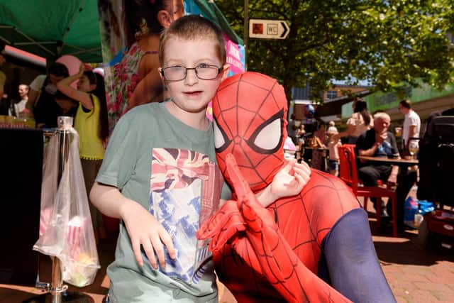 Harry St Ledger, from Portchester, has an inoperable brain tumour. Here he is pictured with Spiderman.
Picture: Duncan Shepherd