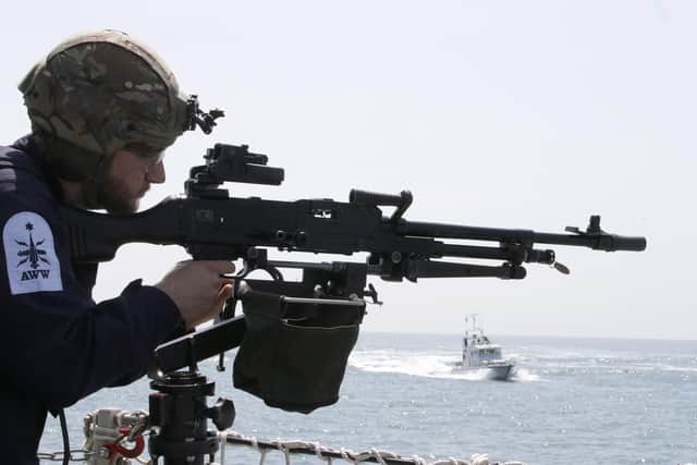 A gunner watches from HMS Lancaster. Photo: Royal Navy