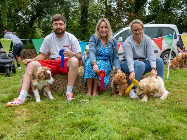 Winners of the Cutest Puppy competition line up at the Denmead Fun Dog Show. Left to right, 2nd place - Jak Enticknap (27) with Ralphie (Australian Shepherd, 5 months), 1st place - Jacqui Humphreys (42) with Rosie (cockapoo, 12 weeks old),  and 3rd place - Lara Clarke (40) with Bear (golden retriever, 6 months old). Picture: Mike Cooter (210724)