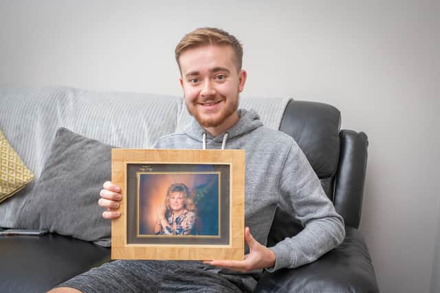 Pictured: Tom Ingram with a picture of his mum at his home in Cosham on 21 August 2020.
Picture: Habibur Rahman
