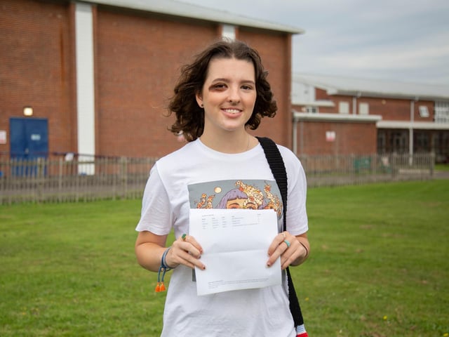 Pictured: Emily Smith with her exceptional results. Her three A*s have landed her a place at the University of Cambridge.