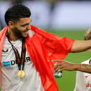 Former Pompey loanee Karim Rekik celebrates with Sevilla team-mate Brazilian Marcao after winning the Europa League final against Roma on Wednesday night. Picture: ODD ANDERSEN/AFP via Getty Images