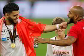Former Pompey loanee Karim Rekik celebrates with Sevilla team-mate Brazilian Marcao after winning the Europa League final against Roma on Wednesday night. Picture: ODD ANDERSEN/AFP via Getty Images