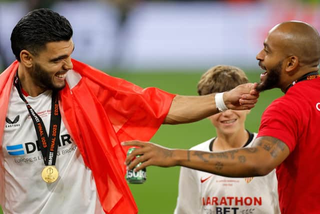 Former Pompey loanee Karim Rekik celebrates with Sevilla team-mate Brazilian Marcao after winning the Europa League final against Roma on Wednesday night. Picture: ODD ANDERSEN/AFP via Getty Images