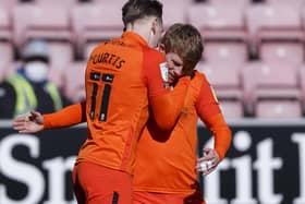 Andy Cannon celebrates his goal at Wigan with Ronan Curtis. Picture: Daniel Chesterton/phcimages.com