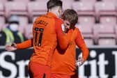 Andy Cannon celebrates his goal at Wigan with Ronan Curtis. Picture: Daniel Chesterton/phcimages.com