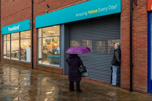 Customers waiting for the opening of the newly located Poundland store in West Street, Fareham. Picture: Mike Cooter (091223)