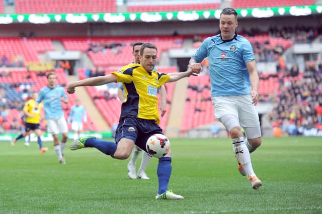Justin Bennett, left, in action for Gosport Borough against Cambridge United in the 2014 FA Trophy final at Wembley. Picture: Paul Jacobs