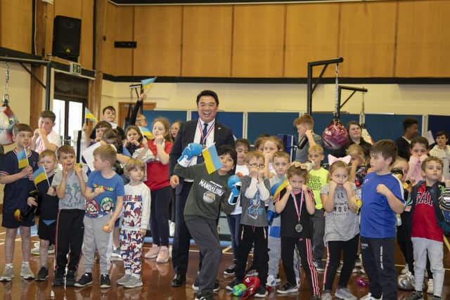 Alan Mak MP with youngsters who attend the weekly Heart of Hayling Boxing Academy sessions
