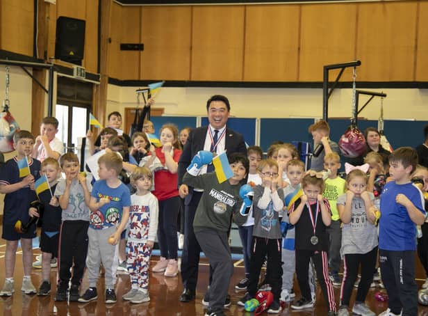 Alan Mak MP with youngsters who attend the weekly Heart of Hayling Boxing Academy sessions