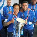 Kyle Bennett (left) and Danny Rose celebrate Pompey's League Two title success on Southsea Common in May 2017. Picture: Joe Pepler