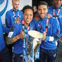 Kyle Bennett (left) and Danny Rose celebrate Pompey's League Two title success on Southsea Common in May 2017. Picture: Joe Pepler