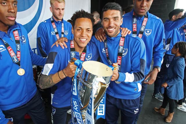 Kyle Bennett (left) and Danny Rose celebrate Pompey's League Two title success on Southsea Common in May 2017. Picture: Joe Pepler