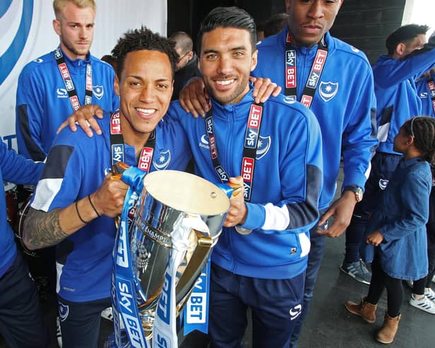 Kyle Bennett (left) and Danny Rose celebrate Pompey's League Two title success on Southsea Common in May 2017. Picture: Joe Pepler