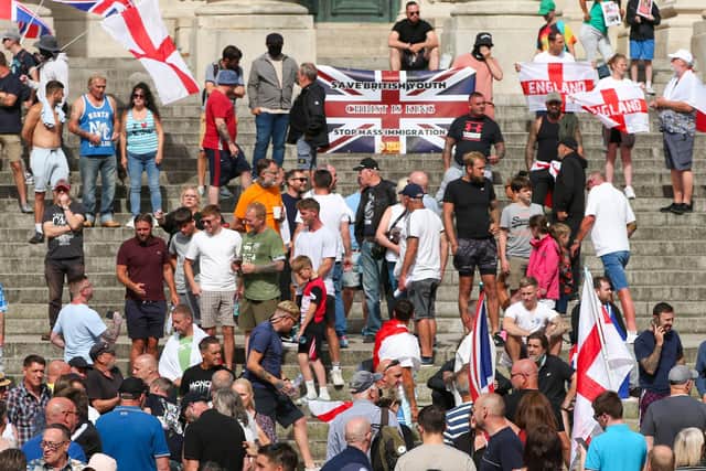 Protestors at Guildhall Square, Portsmouth. Some demonstrators held anti-immigration banners containing "stop the boats" slogans. Picture: Chris  Moorhouse (030824-29)
