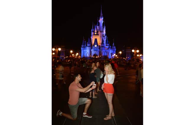 Katy Hunter who tied the knot with James Hunter on December 11 at New Place, Shirrell Heath. Pictured is James proposing to Katy in 2018 at Disney World Florida.