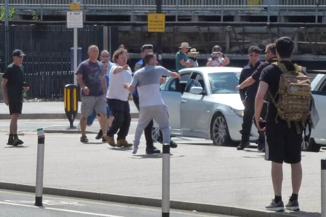 Onlookers watch on as the fracas took place at The Hard Interchange.