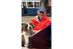 Derek Thompson and his dog Meg.