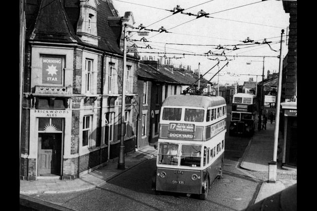 From Barry Cox's book the Trolleybuses of Portsmouth we see  the Morning Star pub on the left and on the right, on the corner of Regent Street, which was just set back a little from Greetham Street, can be seen the Blackfriars Tavern. All of this scene has now been erased.