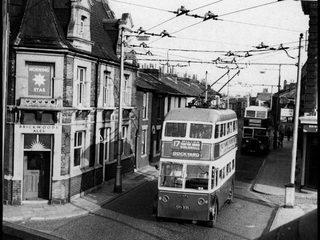 From Barry Cox's book the Trolleybuses of Portsmouth we see  the Morning Star pub on the left and on the right, on the corner of Regent Street, which was just set back a little from Greetham Street, can be seen the Blackfriars Tavern. All of this scene has now been erased.