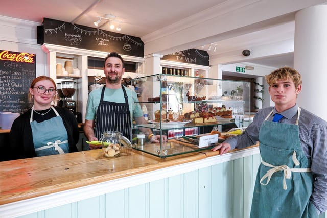 Manager Nick Davies, centre, with fellow staff members, India Sayer and Troy Baldwin, right. The Vine reopens in Stoke Road, Gosport, after a change of ownership Picture: Chris Moorhouse (241024-17)