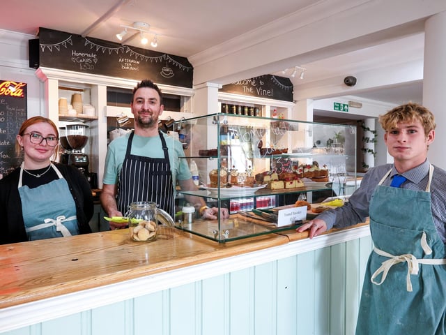 Manager Nick Davies, centre, with fellow staff members, India Sayer and Troy Baldwin, right. The Vine reopens in Stoke Road, Gosport, after a change of ownership Picture: Chris Moorhouse (241024-17)