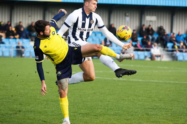 Gosport goalscorer Dan Wooden, left, battles for possession during the 4-0 trouncing of Farnborough. Picture: Tom Phillips