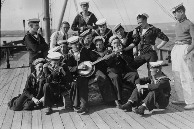 20th August 1936:  Sea Cadets on board the training ship HMS Implacable at Portsmouth harbour, amuse themselves by playing some tunes.  (Photo by E. Dean/Topical Press Agency/Getty Images)