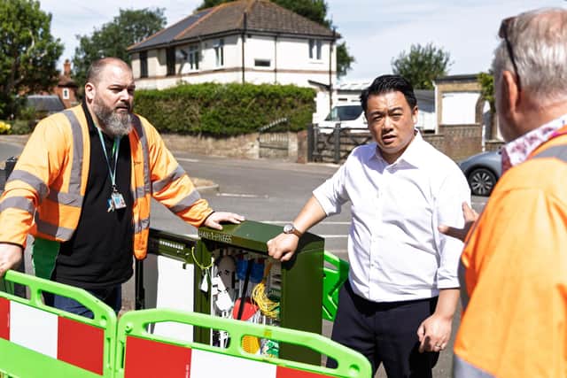 Alan Mak MP at one of the new full fibre broadband cabinets on Hayling Island
