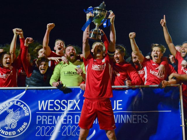 Skipper Ash Howes raises the Wessex League trophy. Picture by Martyn White