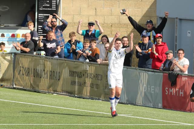 Hawks striker James Roberts celebrates in front of fans after scoring against Hampton & Richmond last weekend. The club are hoping for a big crowd in the Westleigh Park finale against play-off rivals Chippenham this Saturday.  Picture by Dave Haines