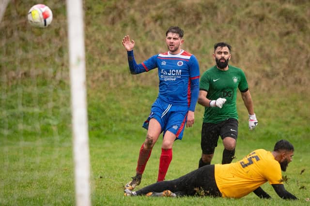 James Cowan scores one of his two goals for The Meon. Picture: Keith Woodland