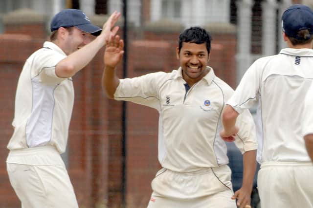 Vickram Dawson (middle) celebrates a wicket. Picture: Mick Young