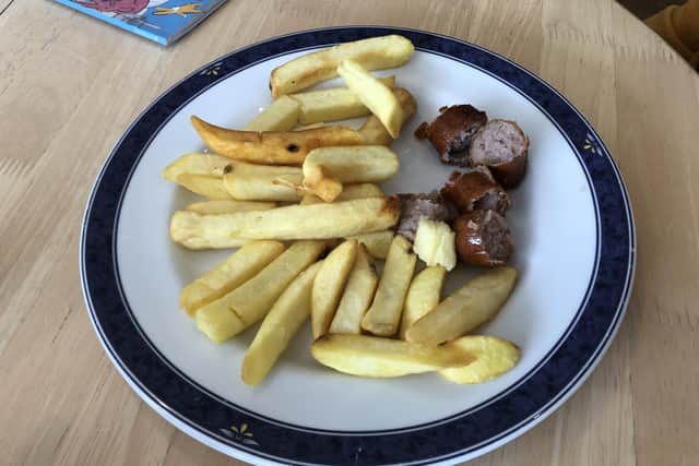A sausage and chips children's meal