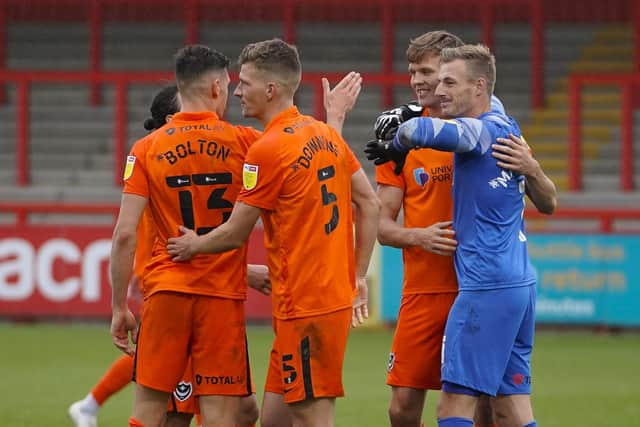 Pompey celebrate their Carabao Cup win at Stevenage. Picture: Jason Brown