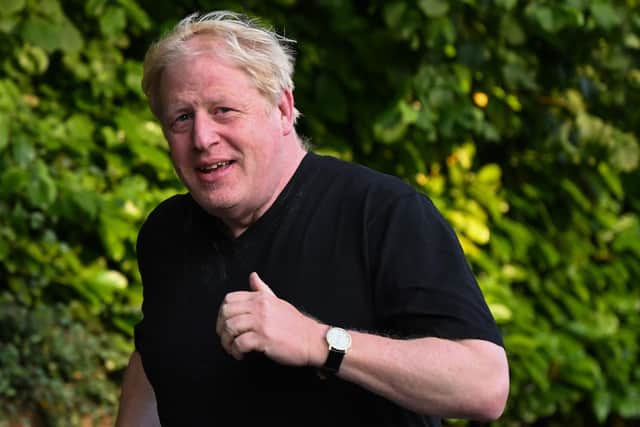 Former prime minister Boris Johnson leaving his house for a run in Brightwell-cum-Stowell, west of London on June 14, 2023. Picture: JUSTIN TALLIS/AFP via Getty Images.