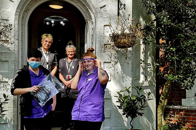 Staff at Belmont Castle Care Home, in Havant, received a donation of more than 10 visors from the group. Picture: Paul Lawson.