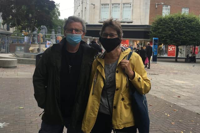 Steve and Jenny Boulter wearing masks in Commercial Road 