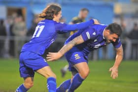 Craig McAllister wheels away, right, after heading Baffins level at Moneyfields. Picture: Martyn White