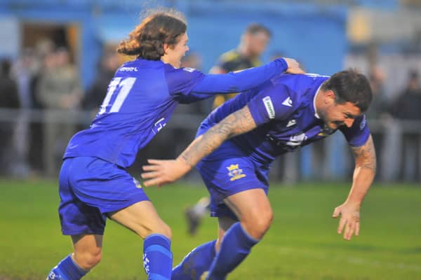 Craig McAllister wheels away, right, after heading Baffins level at Moneyfields. Picture: Martyn White