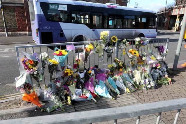 Flowers pictured at the scene where a Gosport teenager died after being hit by a bus outside Gunwharf Quays in Portsmouth, Hampshire, UK.Picture: Sam Stephenson.