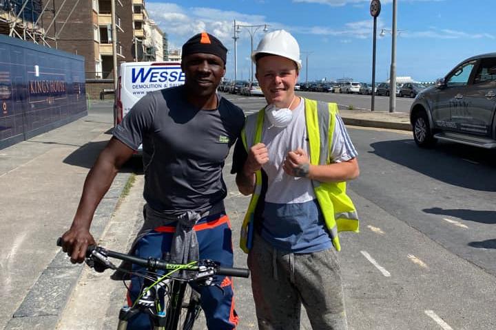 George Thompson with former British boxer Chris Eubank on a construction site in Brighton