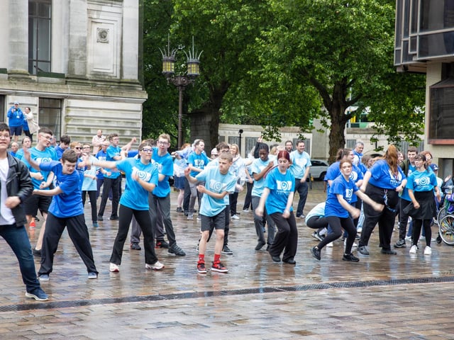 A 250 person strong flash mob took over Guildhall Square to celebrate Portsmouth's 100 years as a city. Pictured - The Flash mob took over Guildhall Square Photos by Alex Shute