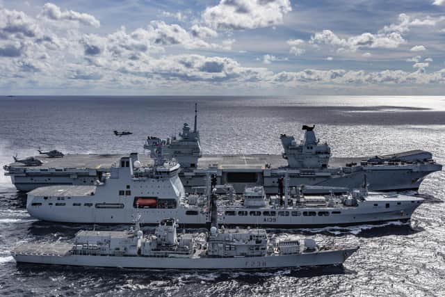 An F-35B Lightning jet lands on HMS Queen Elizabeth as she sails closely with tanker RFA Tideforce and Type 23 frigate HMS Northumberland. This image was part of the Peregrine Trophy winning selection from HMS Queen Elizabeth. Picture by Leading Photographer Kyle Heller.