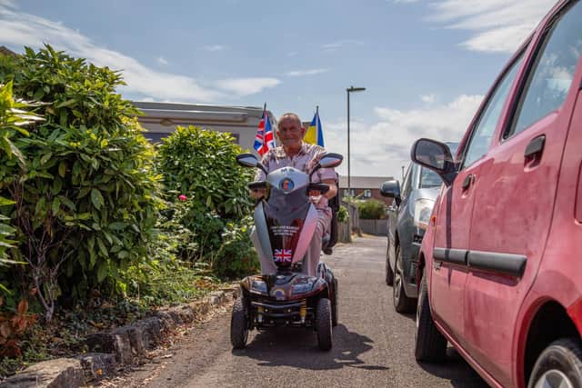 Malcolm driving his scooter. Picture: Habibur Rahman