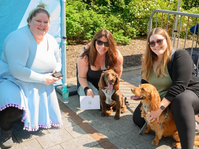 Louisa Warren, Lindsay Hayward and Dannielle Langford with Bronte and Farley, who have just had their paw print made.Picture: Keith Woodland (250521-52)