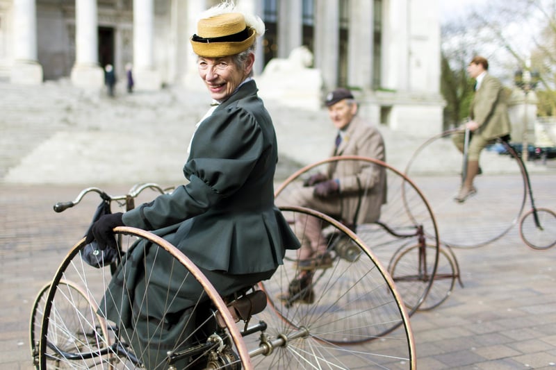 Members of the Pickwick Bicycle Club ride their antique machines during events surrounding the unveiling of a statue of late British writer Charles Dickens at Guildhall Square in Portsmouth on February 7, 2014.  The statue, the only one of Dickens in Britain, was unveiled on the 202nd anniversary of his birth in the city.  AFP PHOTO / CHRIS ISON        (Photo credit should read CHRIS ISON/AFP via Getty Images)
